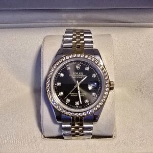 Rolex Datejust with Black Dial and Gold Bezel